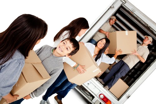 Removal team planning a Camden Town house move with boxes and furniture