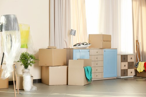 Van moving boxes from a Camden-style apartment