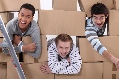 Local removal team handling apartment furniture during flat removals in Camdentown