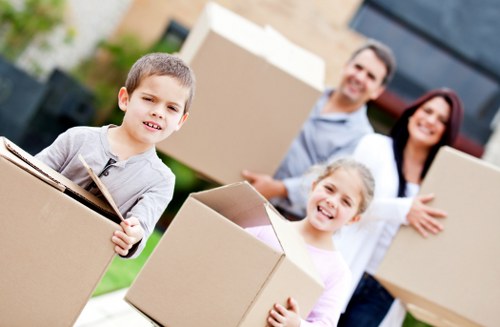Packed moving boxes and furniture ready for a Camden Town removal
