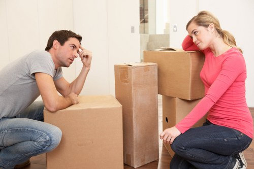 Removal professionals handling access challenges in a Camden Town building