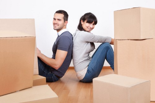 Commercial moving team handling office equipment